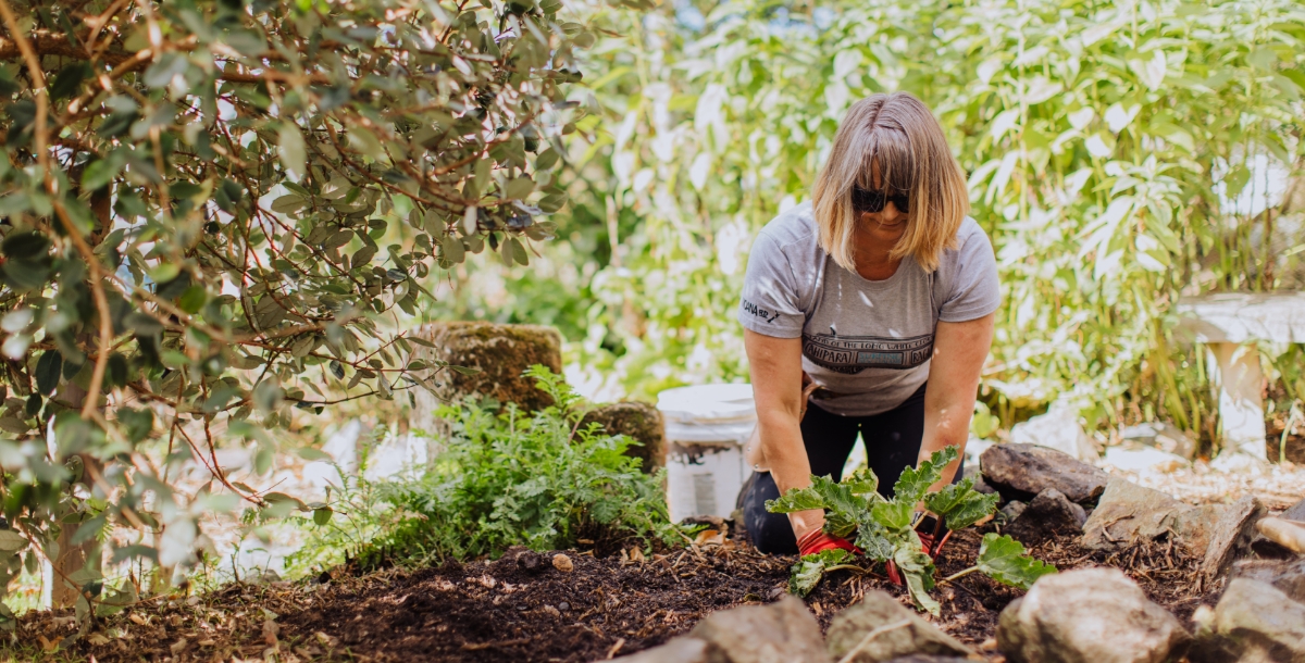 Woman working with hands while gardening
